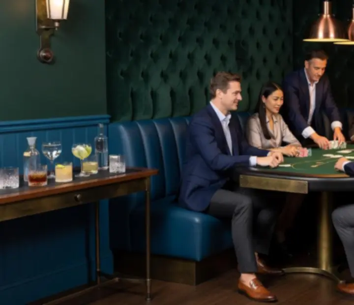 Corporate group enjoying an offline poker lounge evening with premium seating and card tables