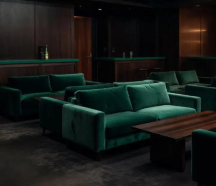 Smoked-glass poker lounge with dark timber, low lighting and deep lounge seating